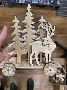 Wooden reindeer on wheels